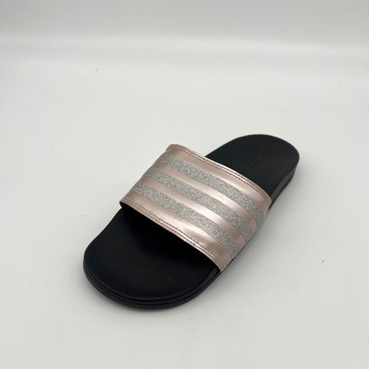 Black slide sandal with a glittery band on a white background