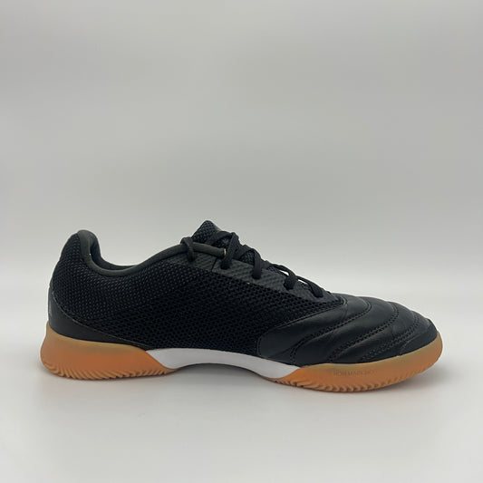 Side view of a black Adidas Copa 19.3 indoor soccer shoe with tonal three stripes, a white midsole, and a tan gum sole on a gray background.