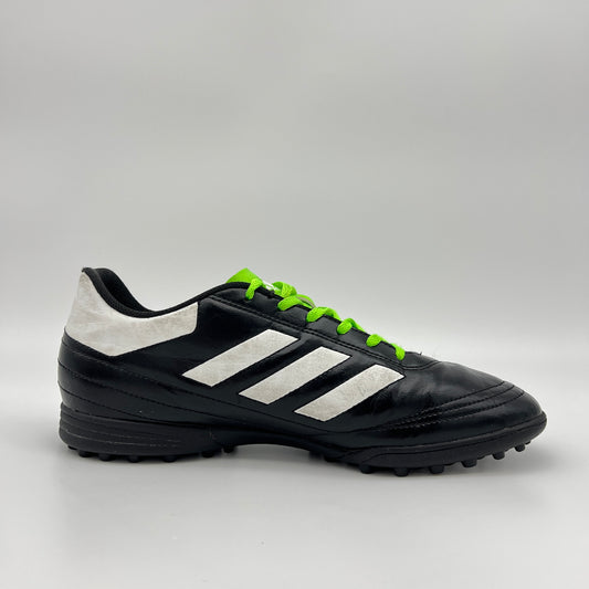 Side view of black Adidas Goletto VI TF soccer shoe with white stripes and green laces