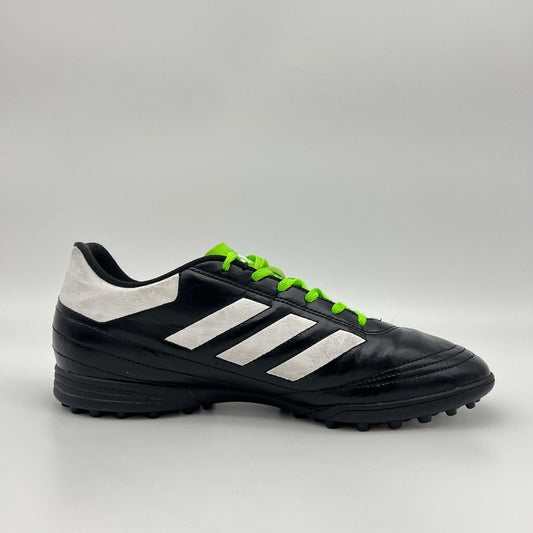 Side view of black Adidas Goletto VI TF soccer shoe with white stripes and green laces