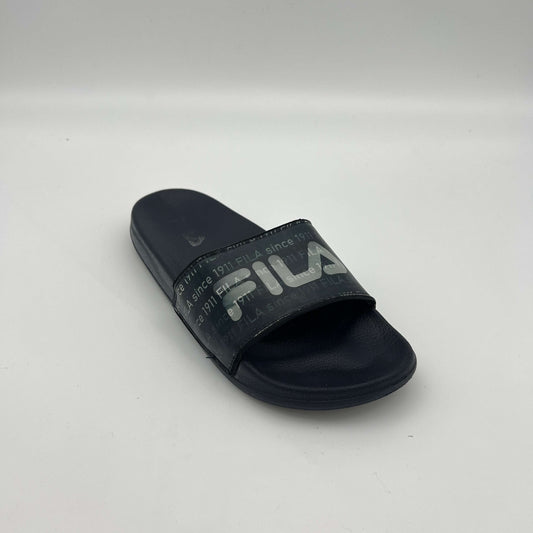 Side view of navy Fila sandals featuring "FILA since 1911" printed repeatedly across the synthetic strap
