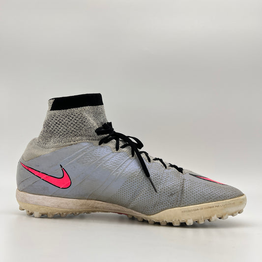 Side profile of a wolf grey Nike MercurialX Proximo TF turf soccer shoe with a bold hyper pink swoosh and a high-top grey and black Dynamic Fit sock collar.