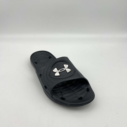 Side view of black Under Armour Locker IV sport slides featuring drainage holes in the sole and strap.