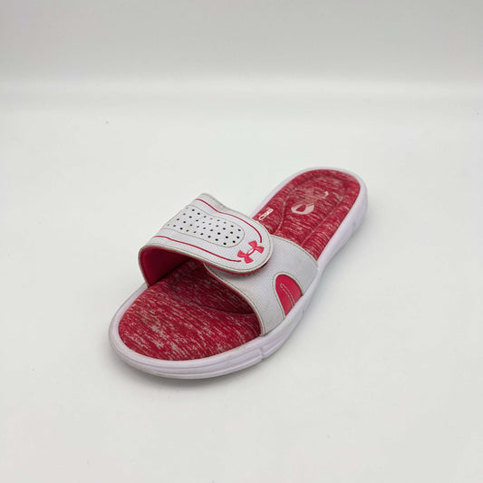 Red and white slide sandal with brand logo on a light gray background