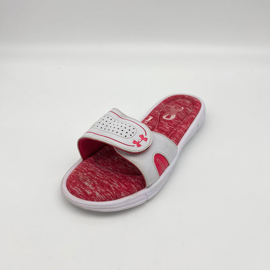 Red and white slide sandal with brand logo on a light gray background