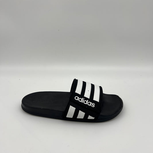 Black and white Adidas Adilette Comfort adjustable slide with three stripes and logo.