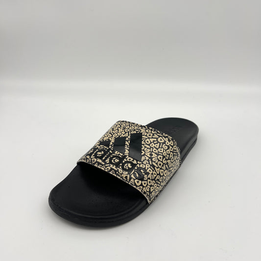 Black slide sandal with leopard print strap on a white background