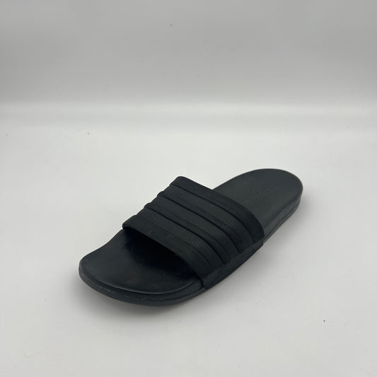 Black slide sandal on a white background