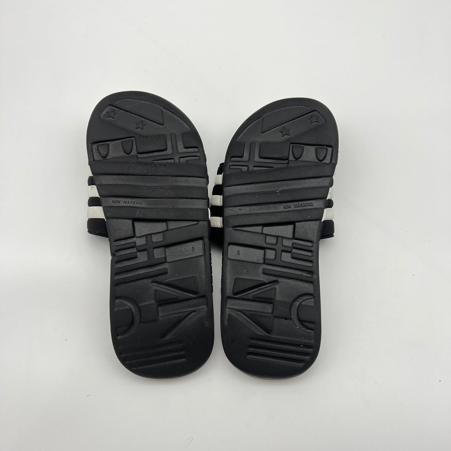 Pair of black sandals on a white background