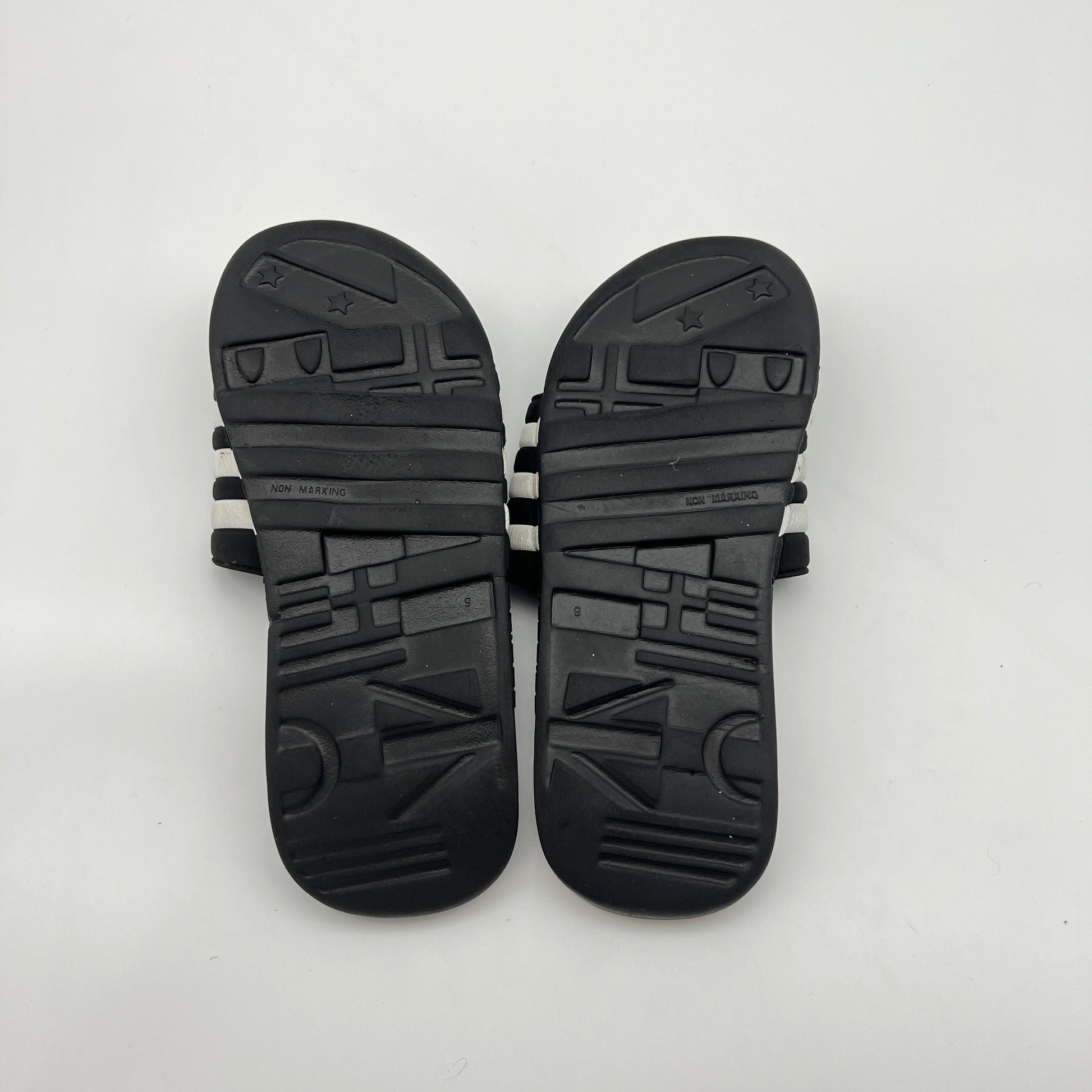 Pair of black sandals on a white background