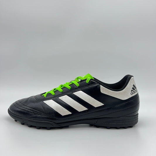 Side view of black Adidas Goletto VI TF soccer shoe with white stripes and green laces