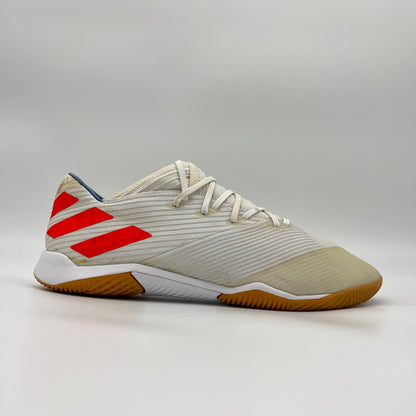 Side view of white Adidas Nemeziz Messi 19.3 indoor soccer shoe with red stripes