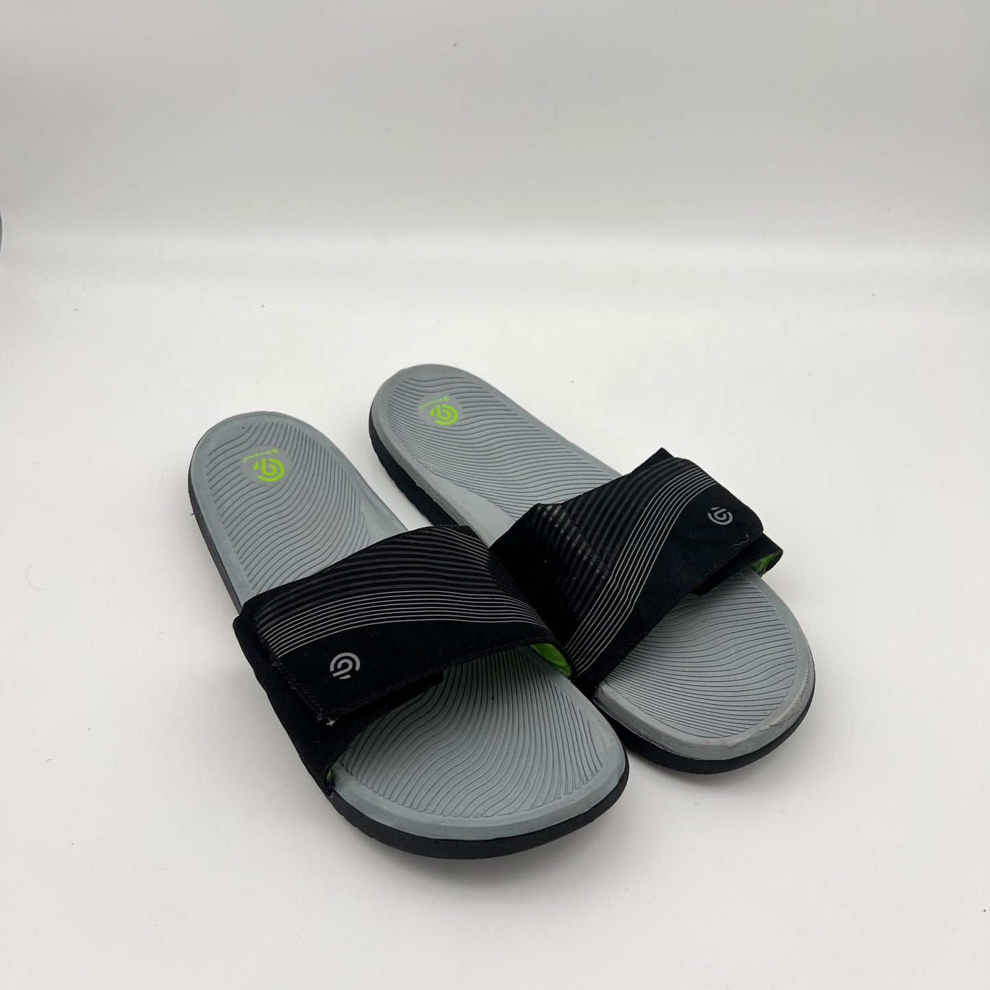 Lightweight Champion slide sandals with neon green logo accent and durable traction outsole