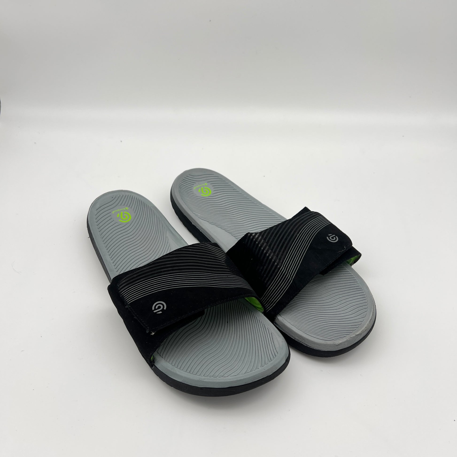 Lightweight Champion slide sandals with neon green logo accent and durable traction outsole
