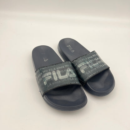 Pair of FILA slides on a light gray background