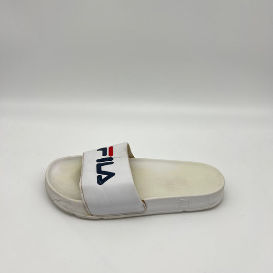 A side view of a white Fila Morro Bay 2.0 slide featuring a navy and red Fila logo on the strap and a thick, contoured sole