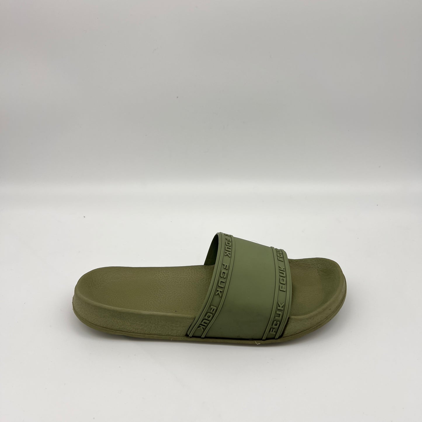 Olive green French Connection Fitch Marquee slide sandals with embossed FCUK logo strap on a white background.
