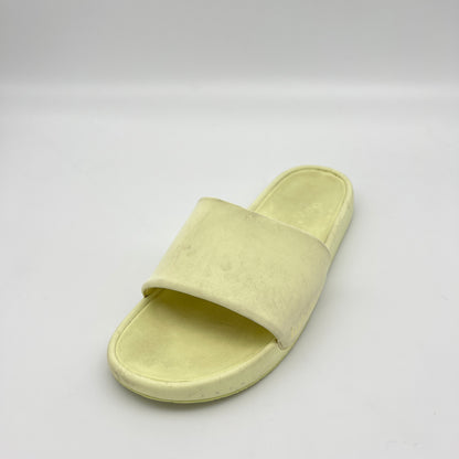 Light green slide sandal on a white background
