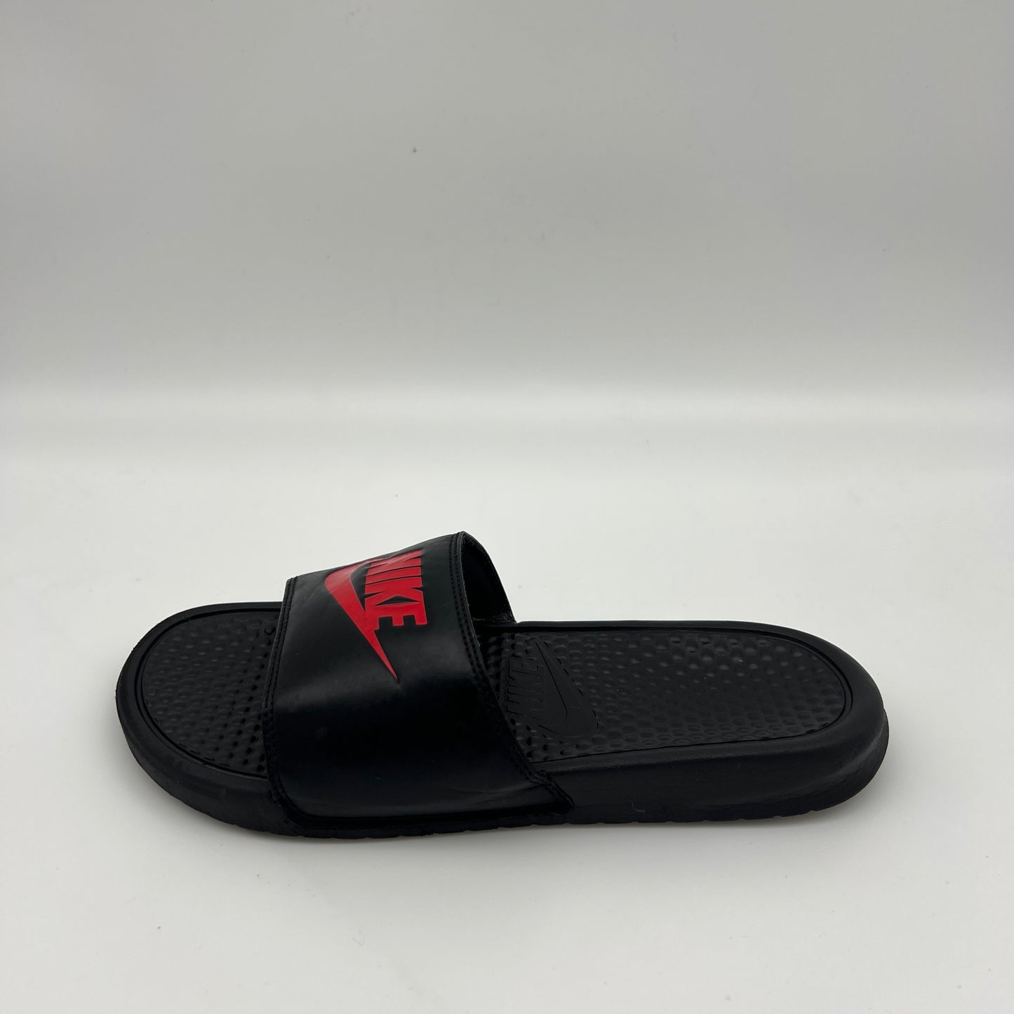 Nike Benassi JDI men's slides in black with red Nike logo