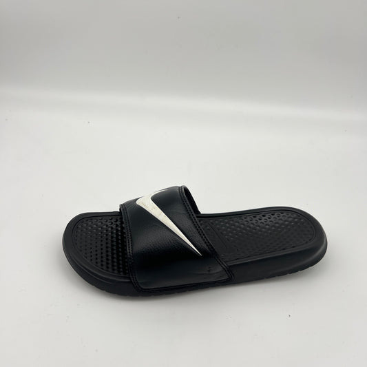 Black Nike Benassi JDI slide sandal with a white swoosh logo and textured footbed.