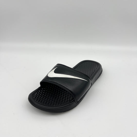Black slide sandal with a white logo on a light gray background