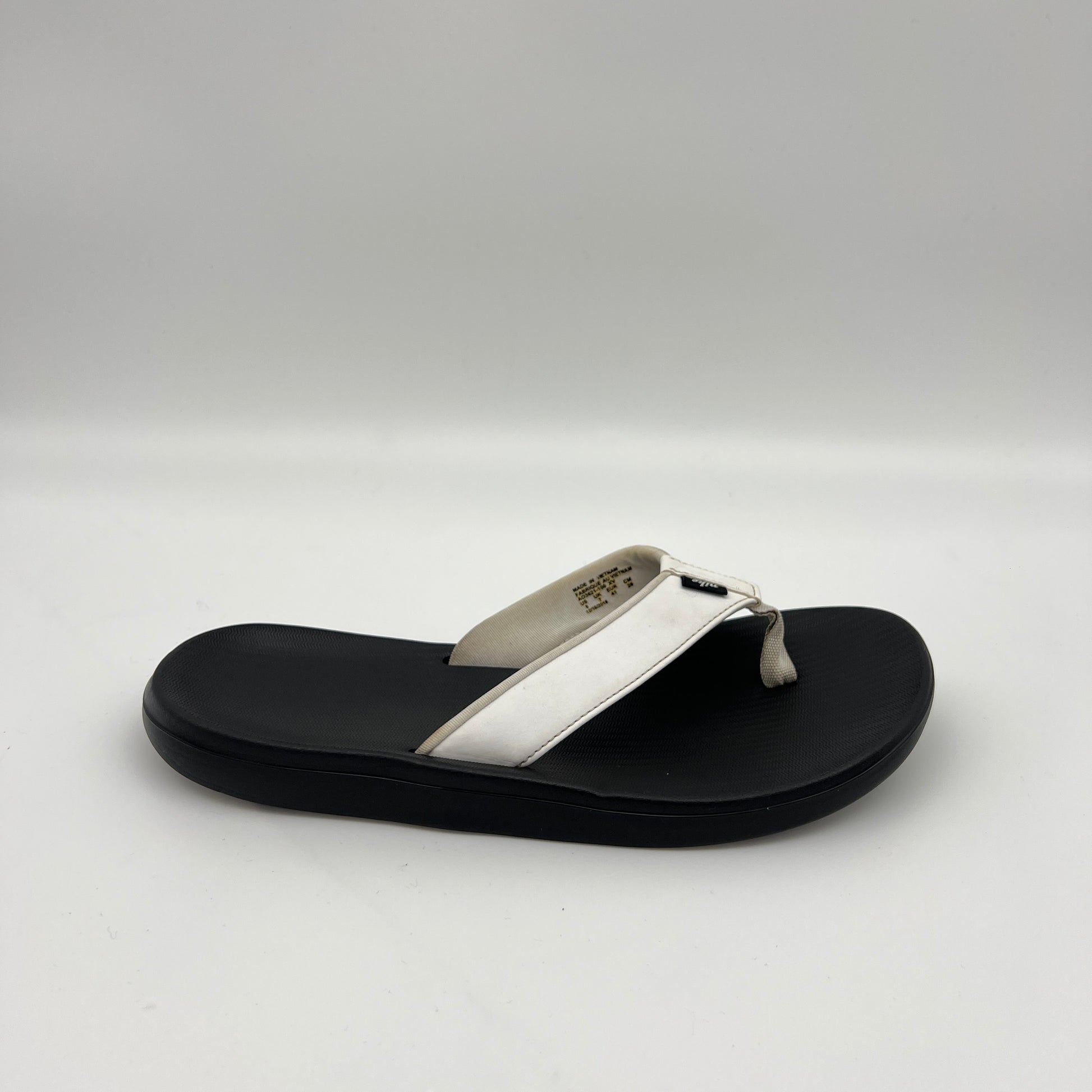 Nike Kepa Kai men's thong sandal in white and black with a wide synthetic strap and textured, cushioned footbed.