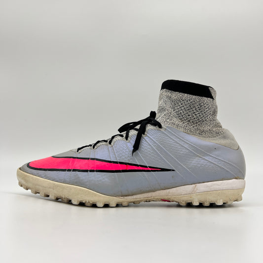 Side profile of a wolf grey Nike MercurialX Proximo TF turf soccer shoe with a bold hyper pink swoosh and a high-top grey and black Dynamic Fit sock collar.