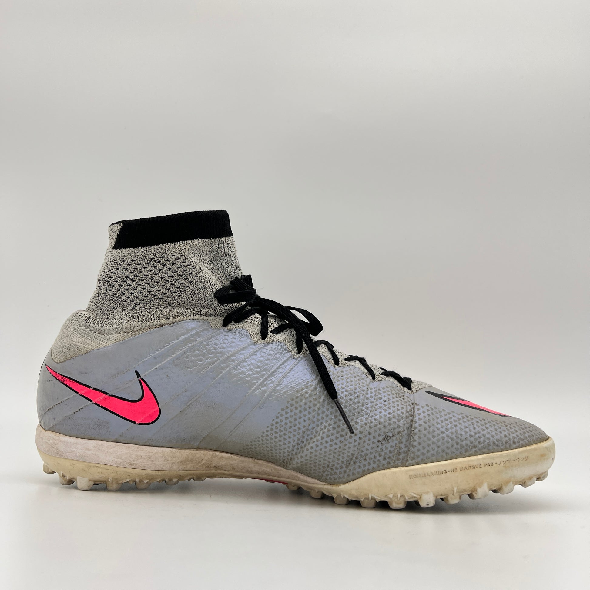 Side profile of a wolf grey Nike MercurialX Proximo TF turf soccer shoe with a bold hyper pink swoosh and a high-top grey and black Dynamic Fit sock collar.
