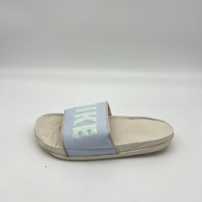 Side view of Nike Offcourt Women’s Slide in Phantom and Barely Green.
