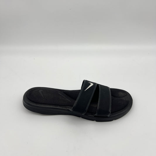 Black Nike Ultra Comfort 3 women's slide sandal with white swoosh and double strap design.