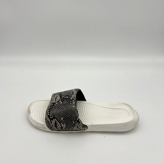 Nike Victori One women's slide sandal with black and white snakeskin print strap on a white footbed.