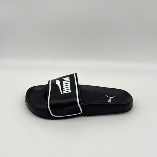  PUMA Leadcat 2.0 Elevate slide in black with a white PUMA logo and border on the strap and a contoured black footbed with heel logo