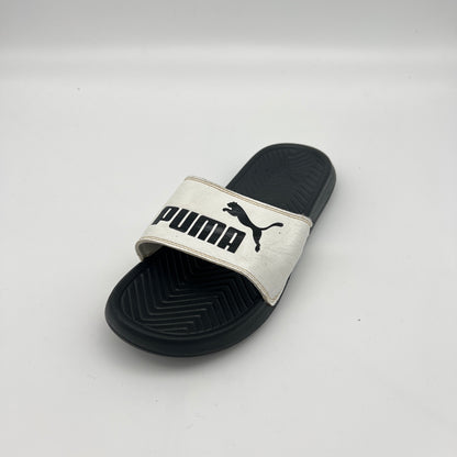 Puma slide sandal on a light gray background