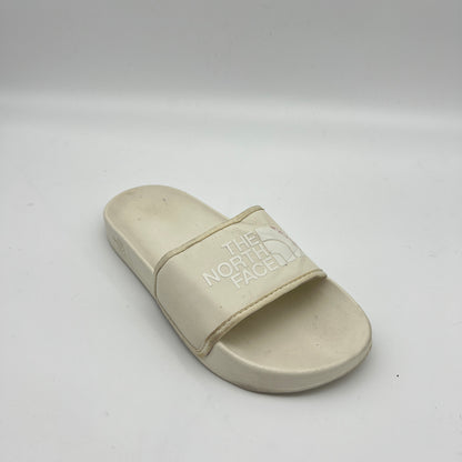 Beige sandal with 'The North Face' logo on a white background