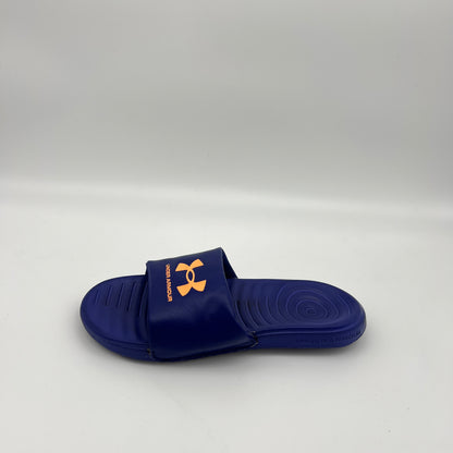 A single royal blue Under Armour Ansa Fixed slide sandal with a bright orange logo on the strap, displayed against a clean white background.