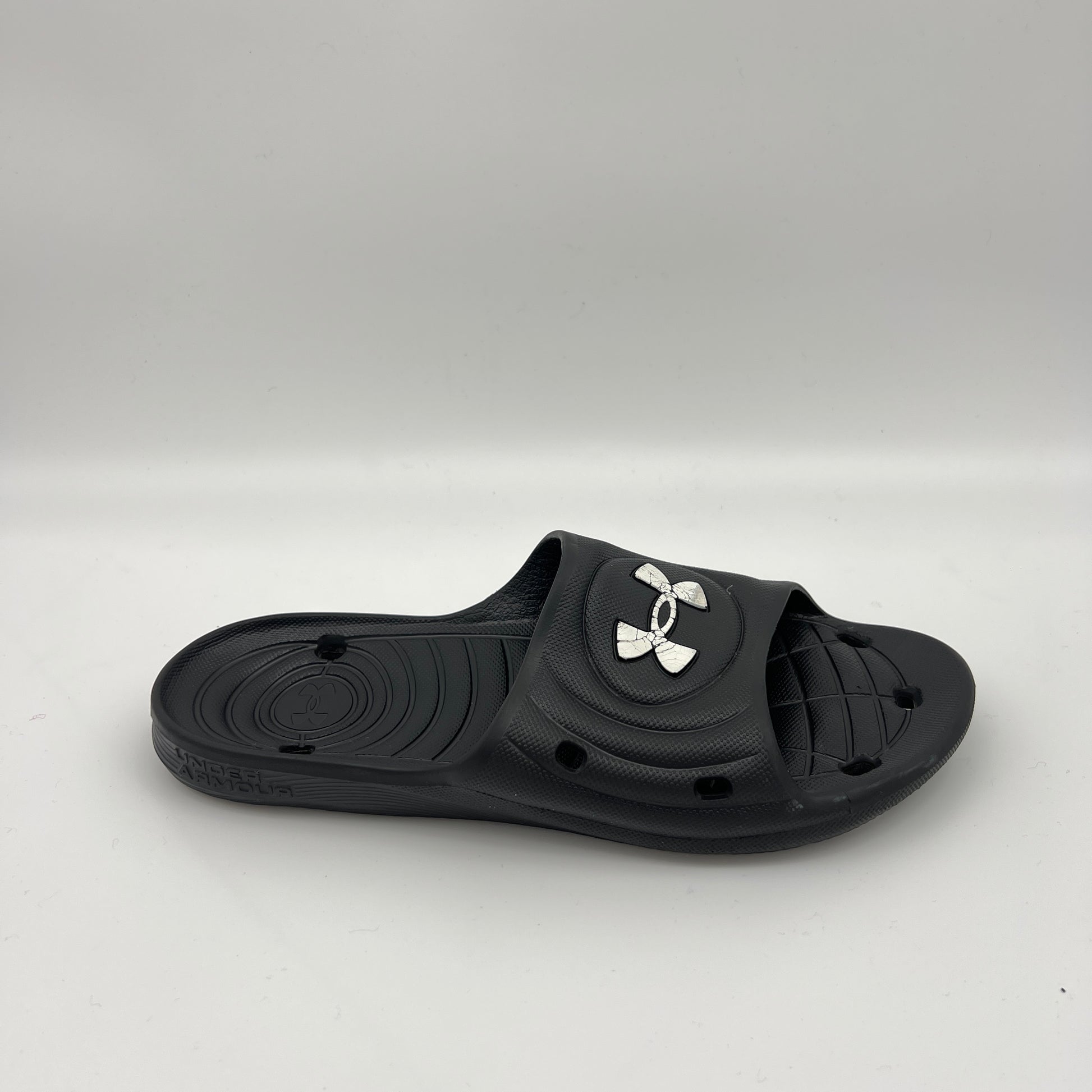 Under Armour Locker IV slides in black with white logo.