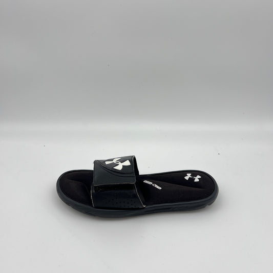 Side view of Under Armour Men's Ignite VI slide in black and white with a contoured 4D Foam footbed