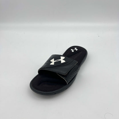 Under Armour athletic slides featuring an adjustable logo strap and plush memory foam cushioning