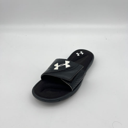 Under Armour athletic slides featuring an adjustable logo strap and plush memory foam cushioning