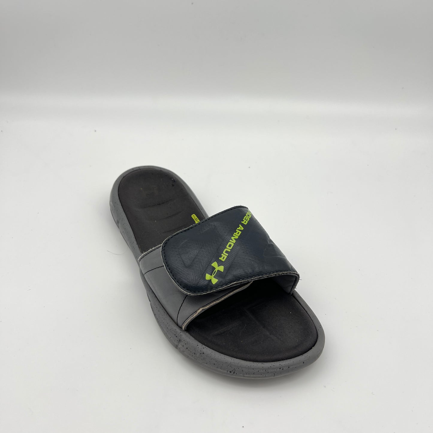 Under Armour athletic slides featuring an adjustable logo strap and 4D Foam cushioned footbed