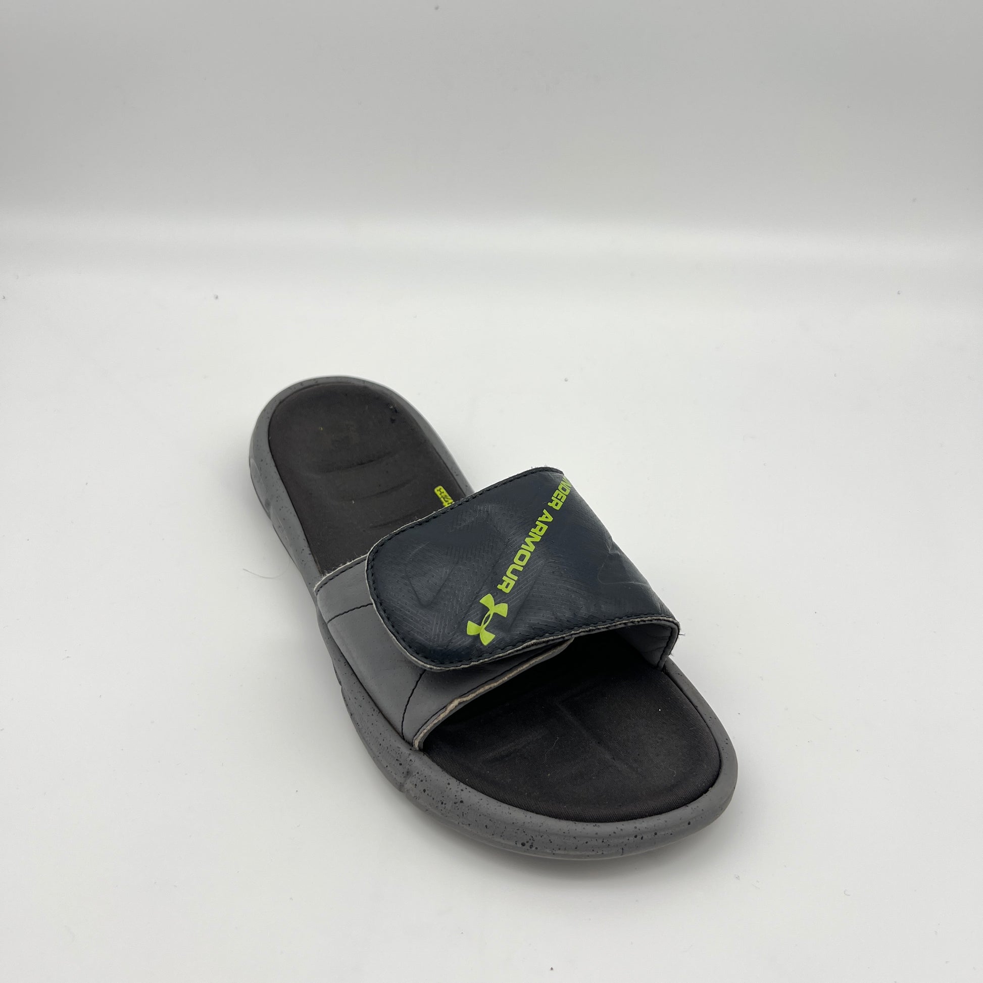 Under Armour athletic slides featuring an adjustable logo strap and 4D Foam cushioned footbed