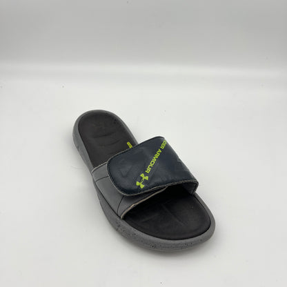 Under Armour athletic slides featuring an adjustable logo strap and 4D Foam cushioned footbed