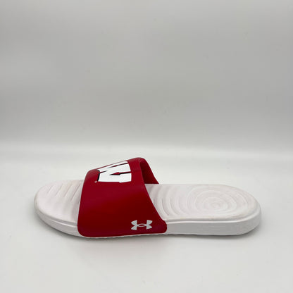 Side profile of a red and white Under Armour Wisconsin Badgers Ansa slide sandal on a white background, featuring the white "W" logo and a white EVA sole.