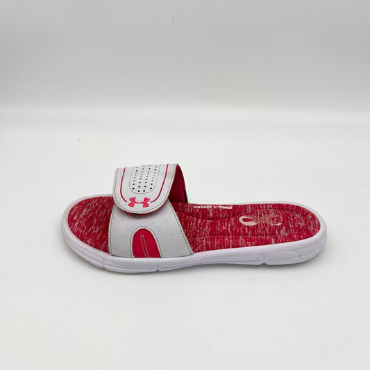 White Under Armour Ignite Pip slide with Tropic Pink heathered memory foam footbed and adjustable Velcro strap.