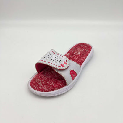 Red and white slide sandal with brand logo on a light gray background