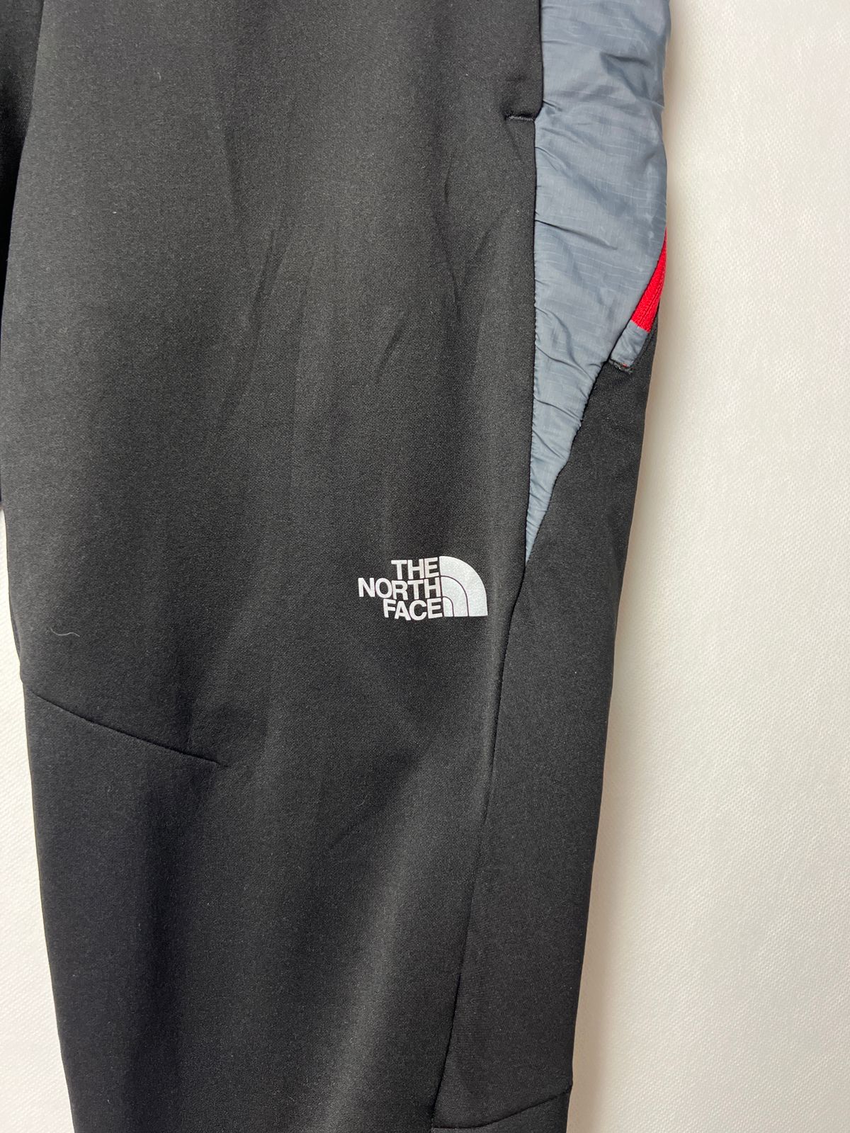 The North Face Men's Track Pants with Red Zipper Accent