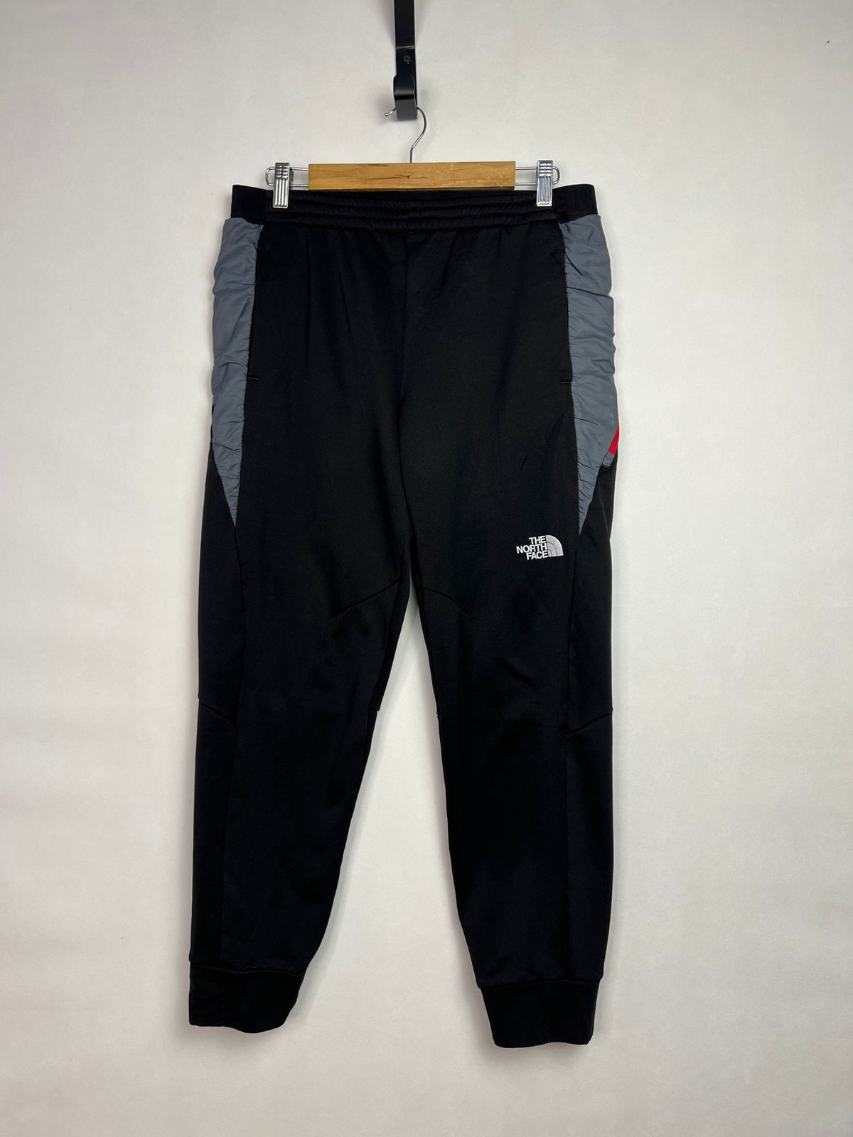 The North Face Men's Track Pants with Red Zipper Accent
