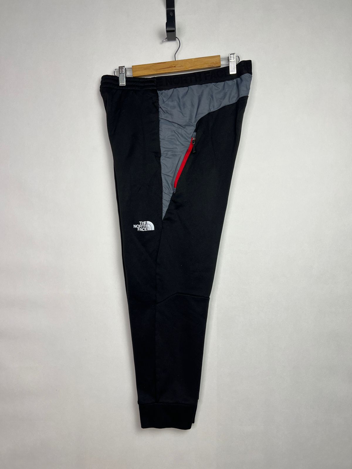 The North Face Men's Track Pants with Red Zipper Accent