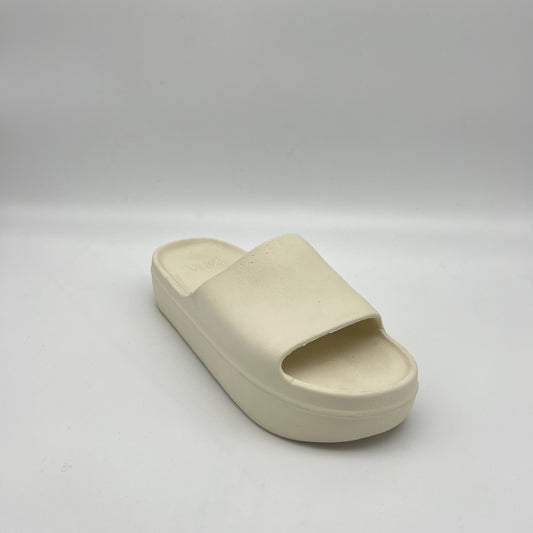 Beige slide sandal on a light gray background