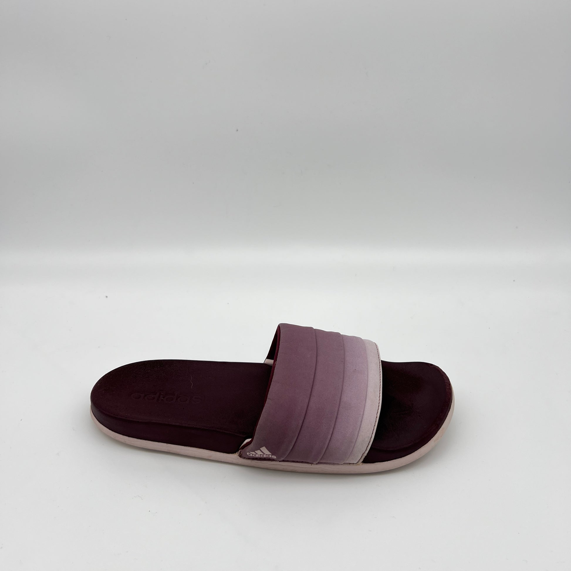 adidas Adilette Cloudfoam Ultra Armad slide sandal with a maroon and purple gradient quilted strap and a dark burgundy contoured footbed.